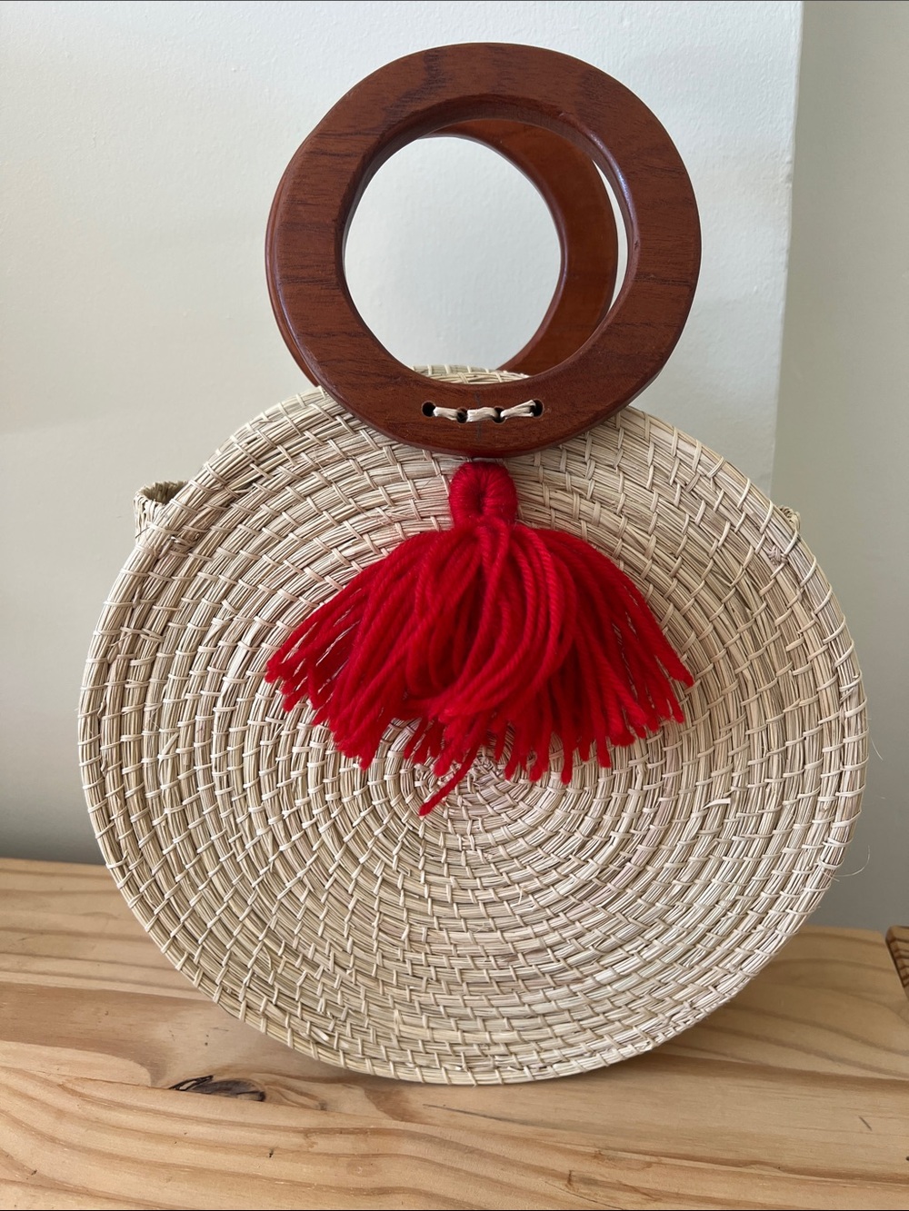 Woven Round Straw Tote with Red Tassel and Wood Handles